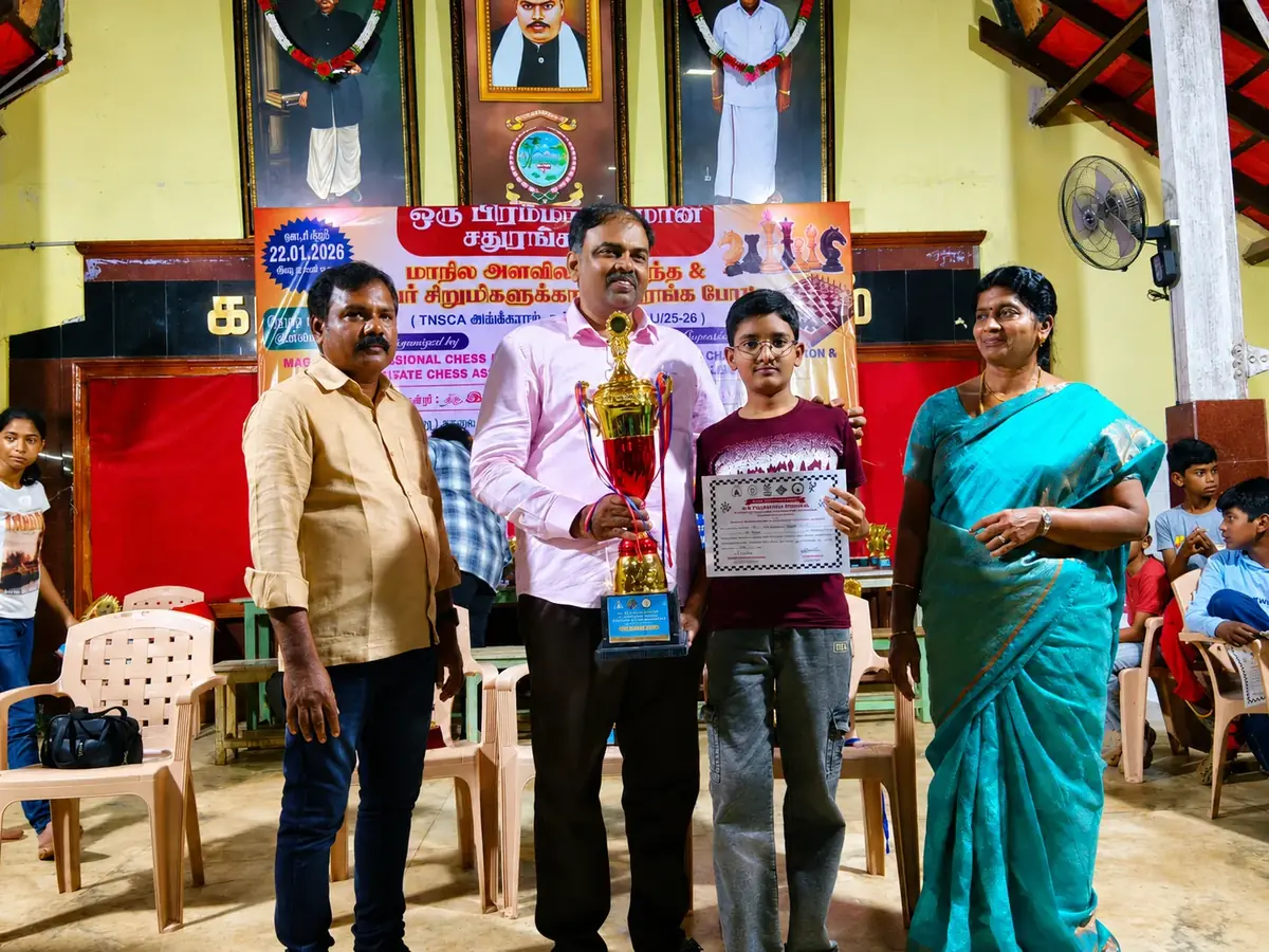 A player receiving a trophy at a Thanjavur district chess tournament